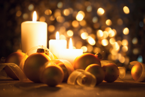 Warm Night Christmas decorations  with candles, baubles and ribb