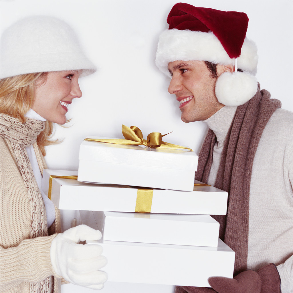 Man and Woman Exchanging Christmas Gifts