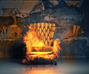 burning armchair in the grunge interior. 3D illustration creativ